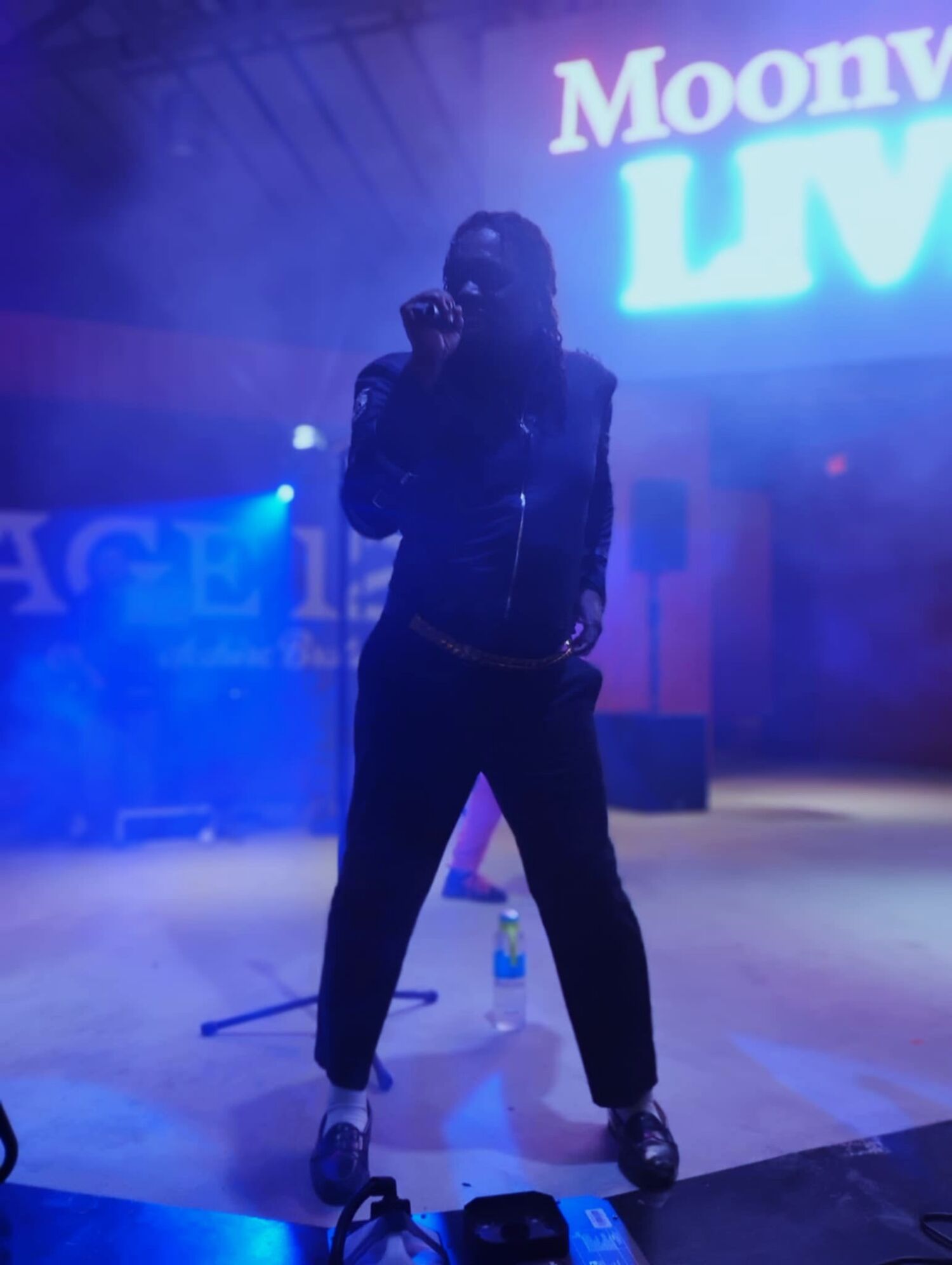 DJ performing in a dramatic live event setting